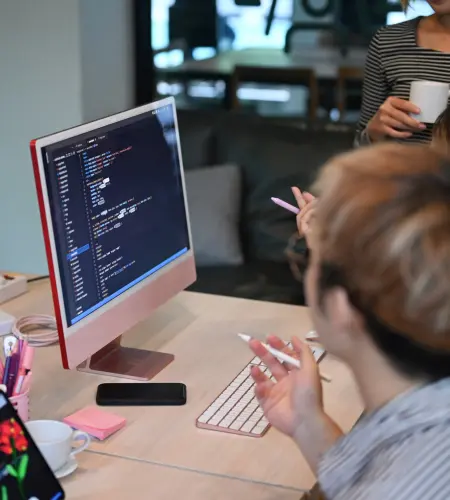 Custom web development team working on coding and UI design
